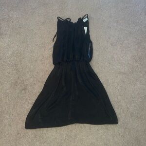 Black dress. Around knee-length.
